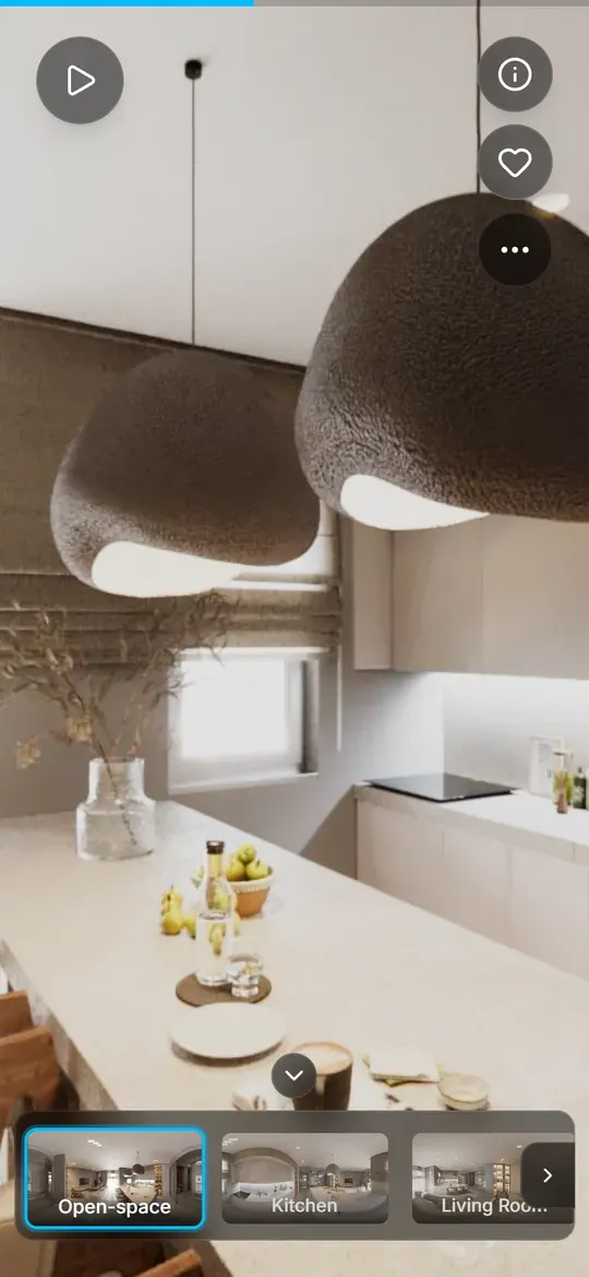 Un tour 360 aperto su un telefono: un'isola della cucina sotto due lampade a sospensione e, in basso, le miniature delle stanze